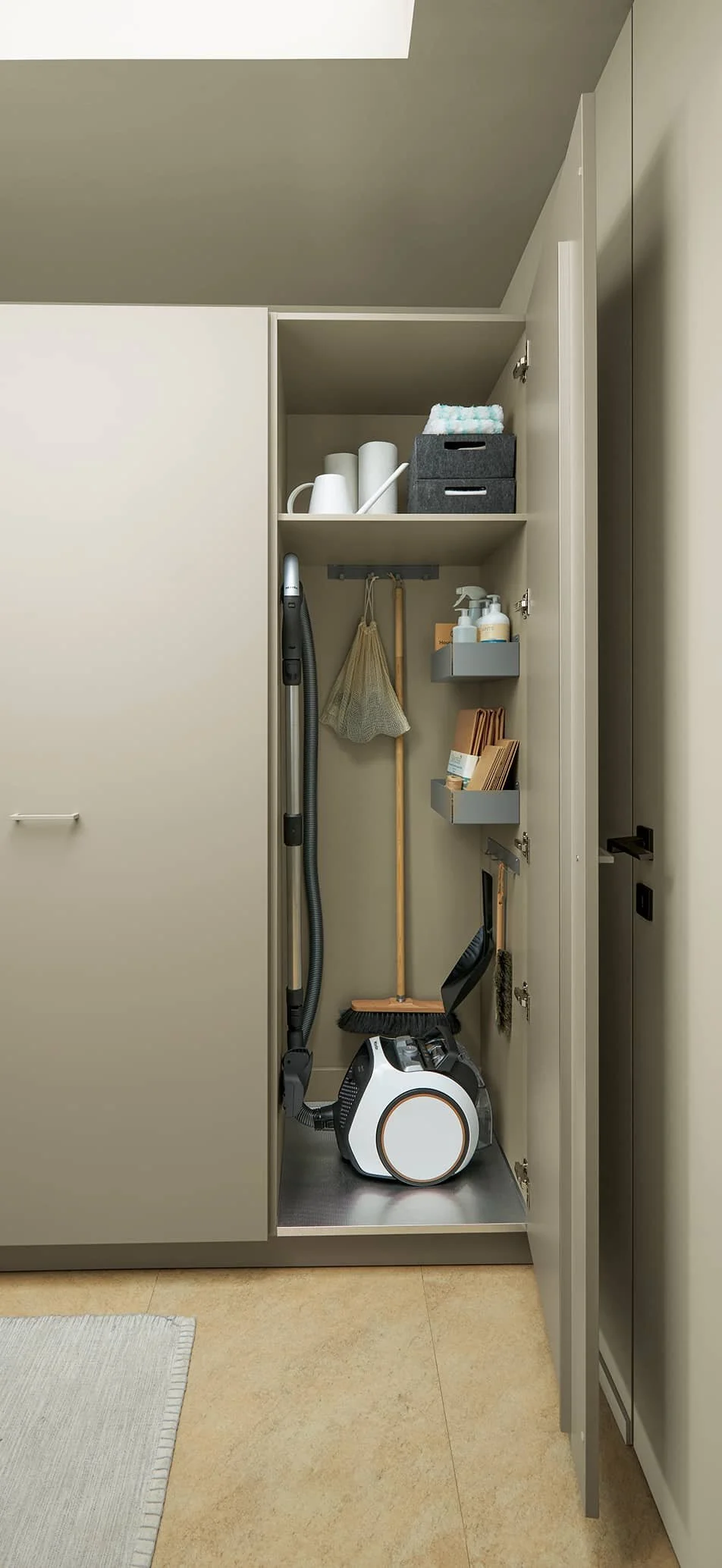Utility room with tall storage cupboards