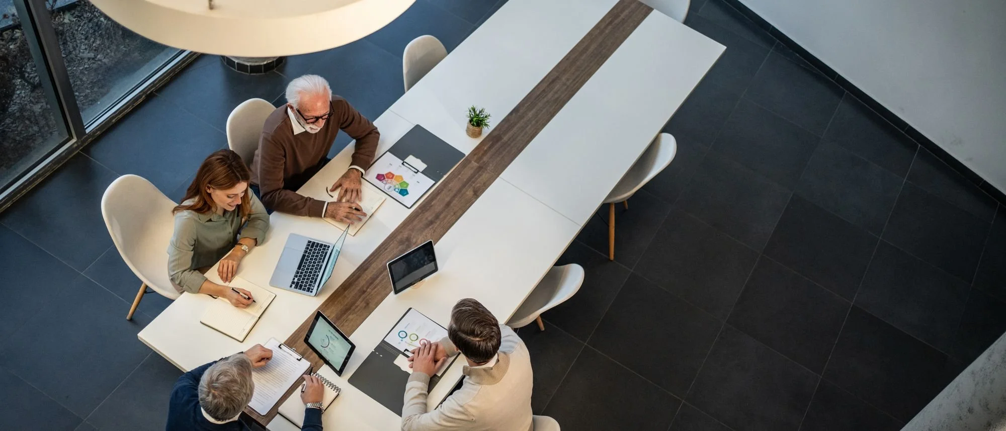 Team working around a table, seen from above