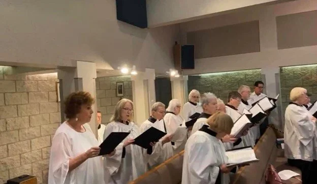 The St. Timothy's Episcopal Church choir practicing hymns inside the sanctuary in Henderson, NV.