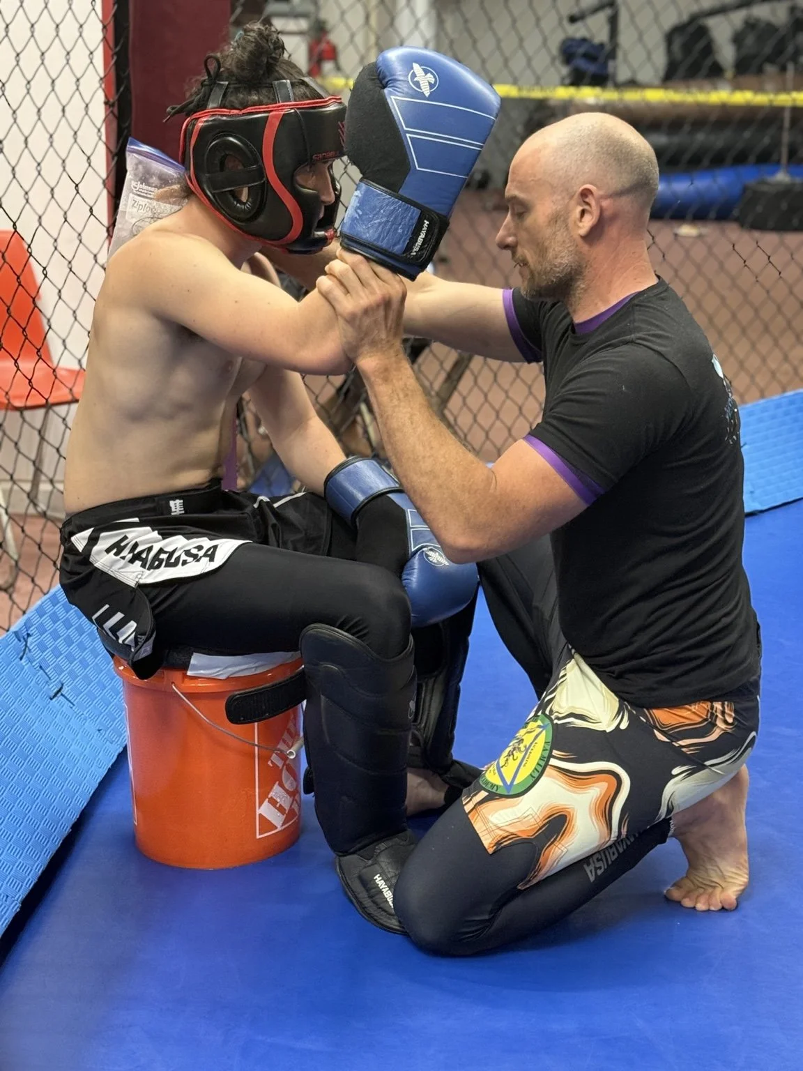 Owen Lawyer coaching a kickboxing student