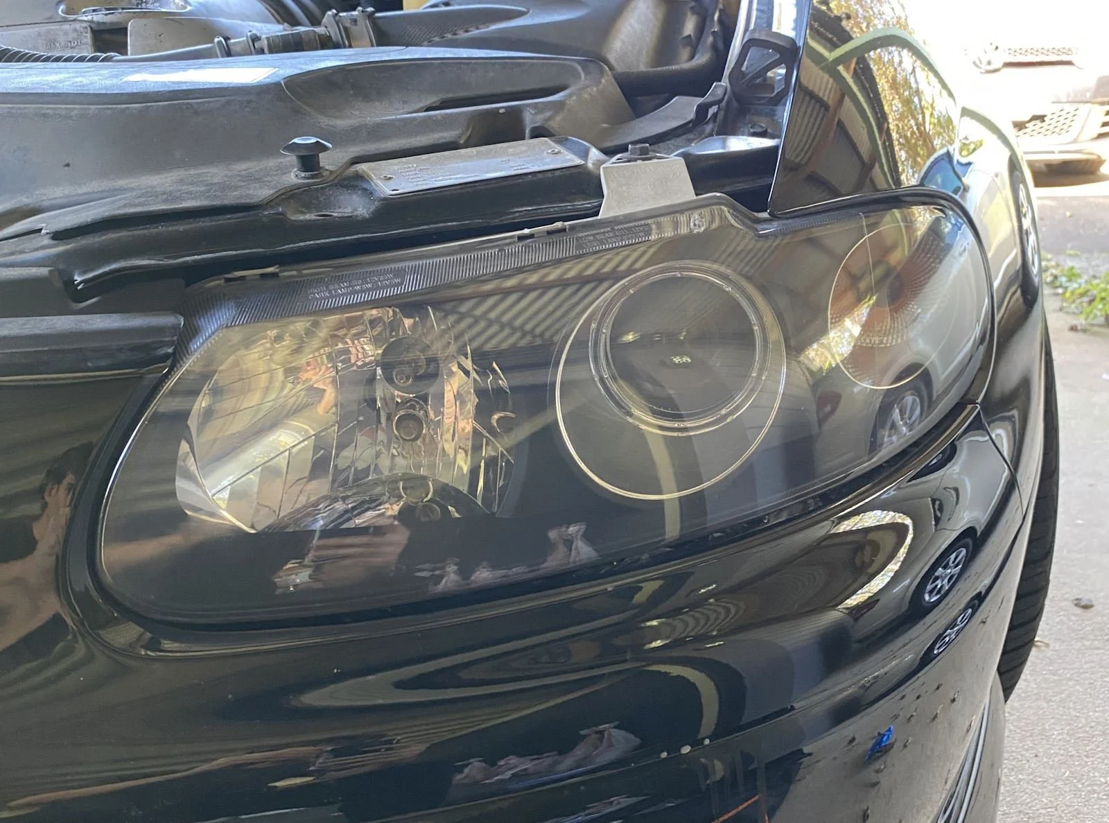 Headlight after Prestige Cleaning restoration — crystal clear