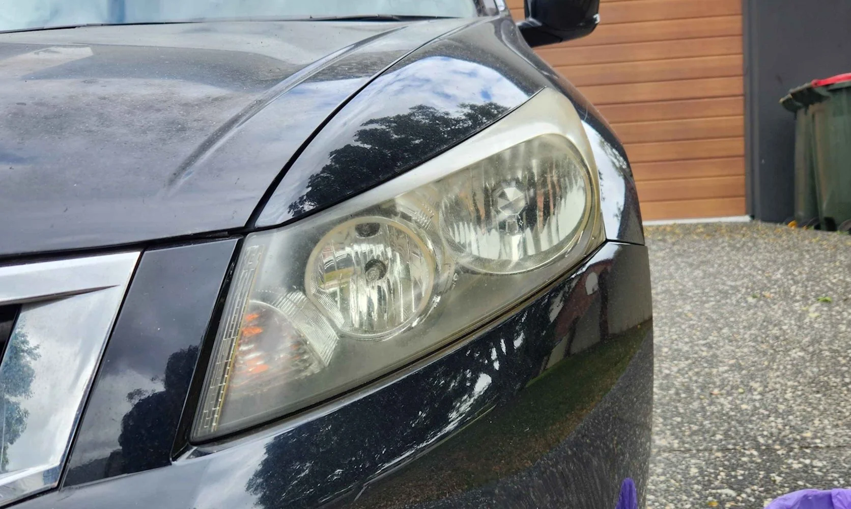 Cloudy, yellowed headlight before restoration