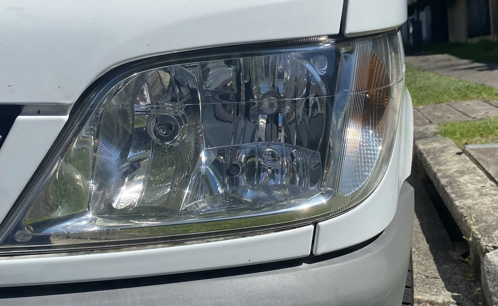 Headlight after Prestige Cleaning restoration — crystal clear