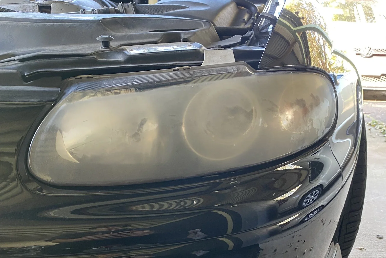 Cloudy, yellowed headlight before restoration