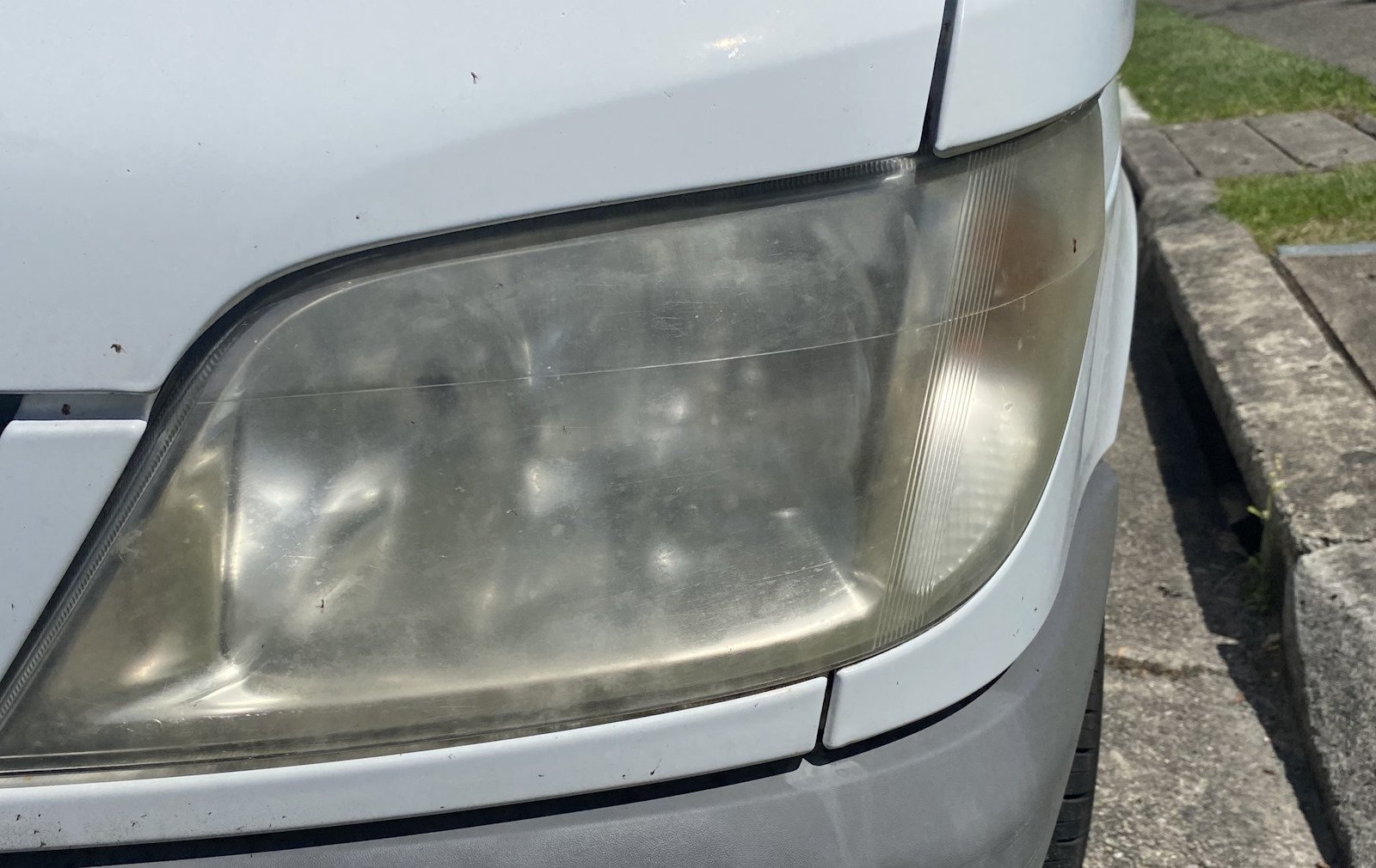 Cloudy, yellowed headlight before restoration