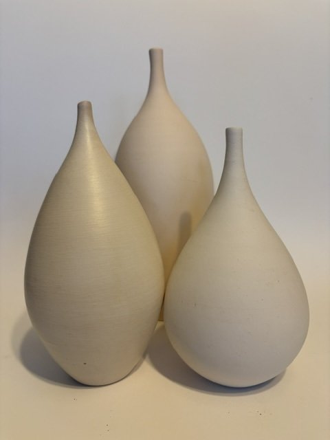 Pale closed ceramic forms by David LaPierre