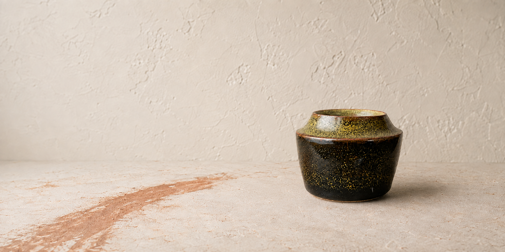 Black tea-dust glazed ceramic vessel made at Firebox Pottery Studio