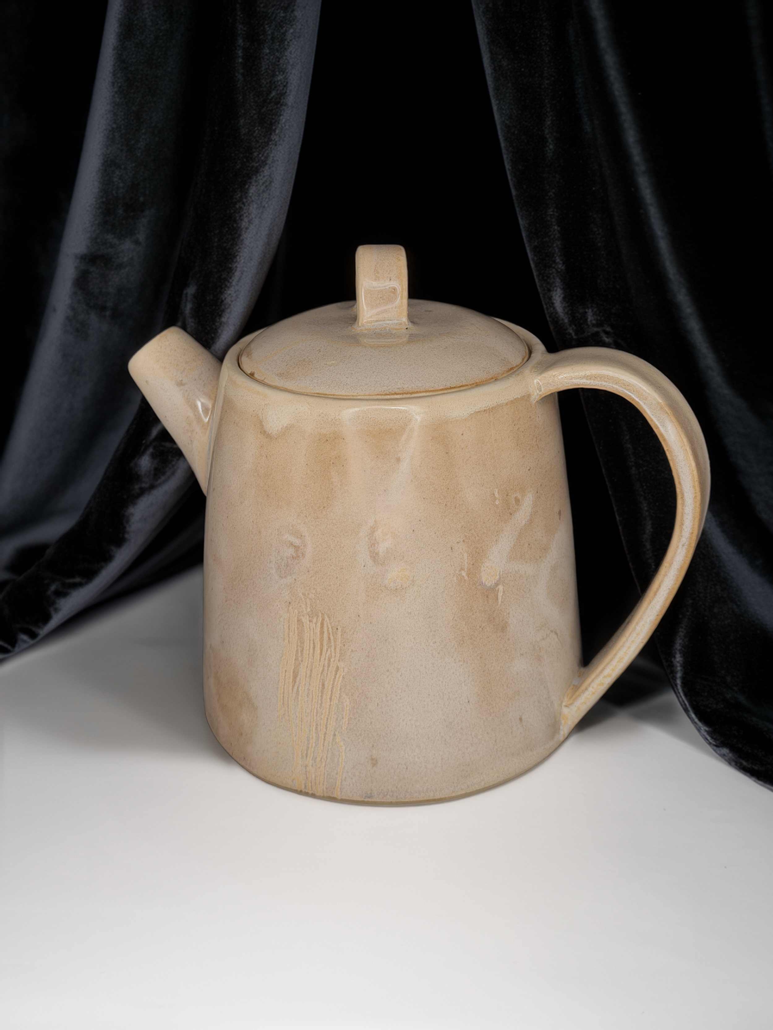 Cream-colored ceramic coffee pot by Mira Etingof