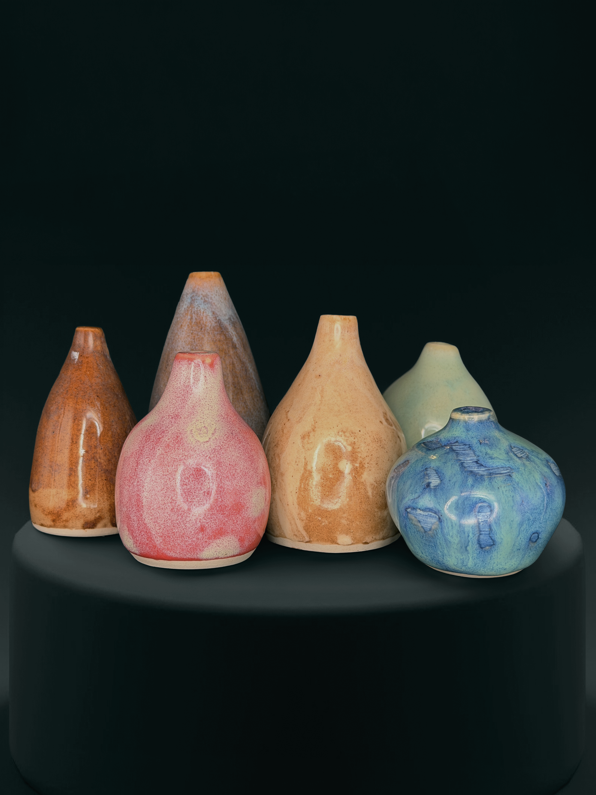 Group of colorful small ceramic vessels by Mira Etingof