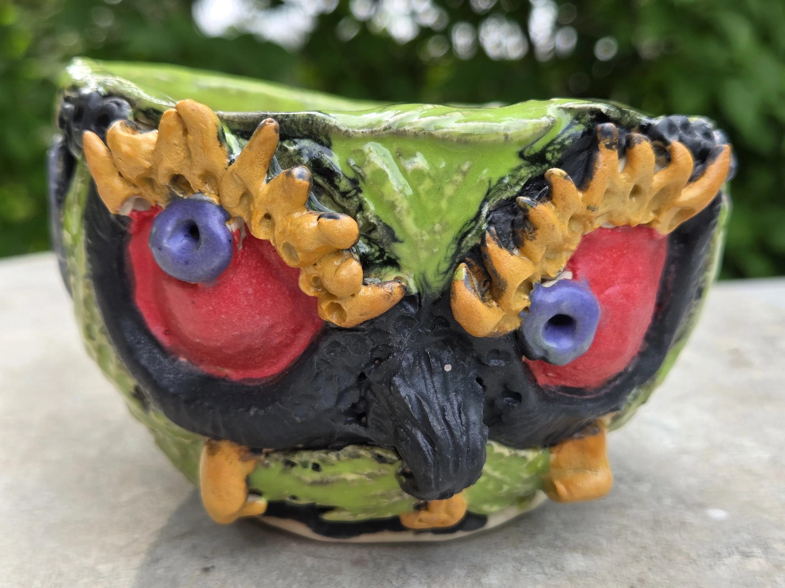 Brightly glazed sculptural owl vessel by Moe Lewis-Wolf with colorful surface details