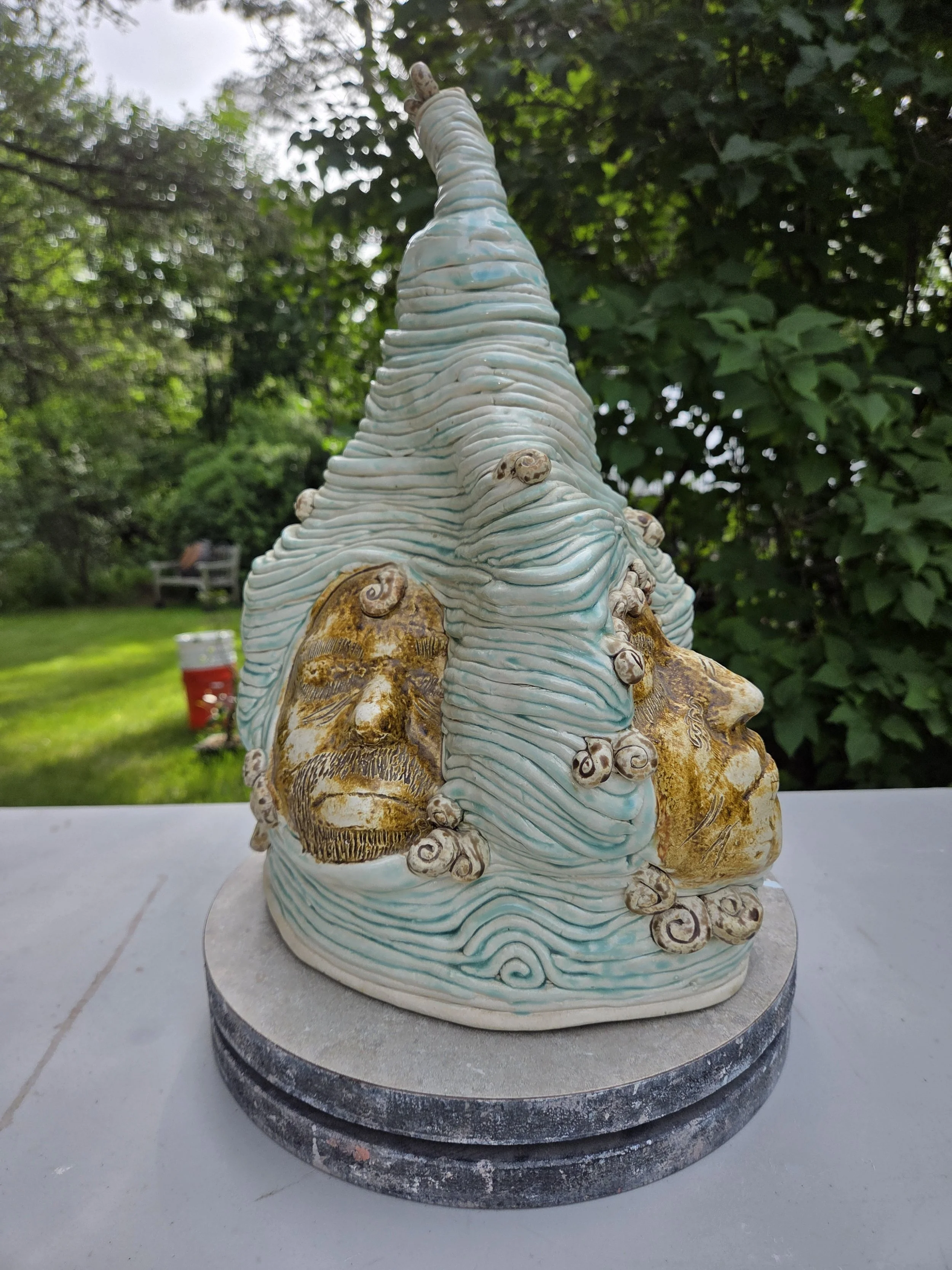 Tall pale-blue organic ceramic sculpture by Moe Lewis-Wolf with layered coils and textured panels