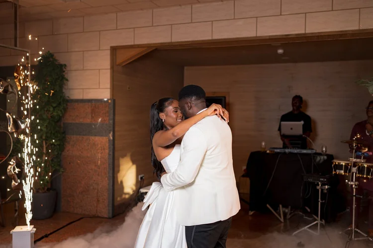 Bride and groom sharing their first dance at the wedding reception