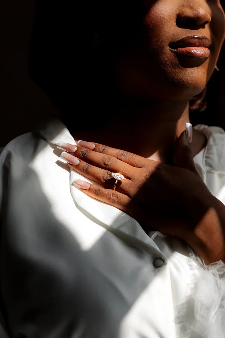 Engagement ring detail in window light