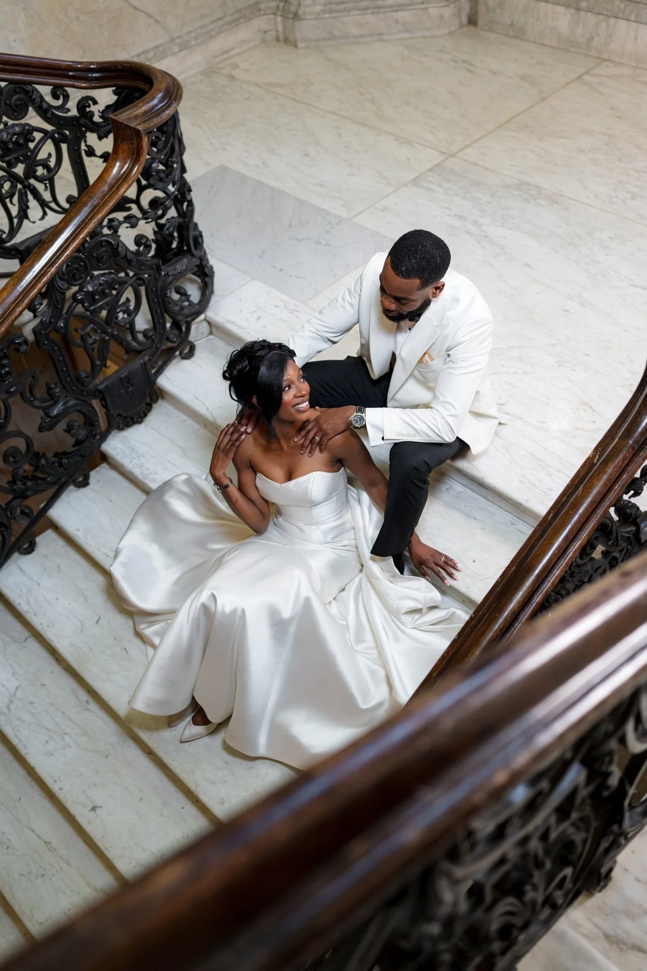 Lami and Andrew on the grand staircase at Dartmouth House, Mayfair