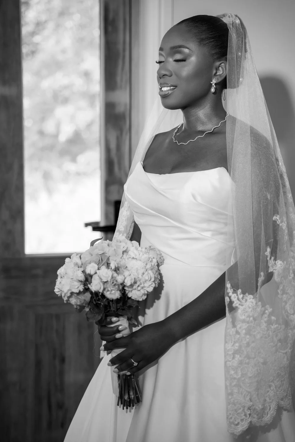 Black and white bridal portrait with bouquet
