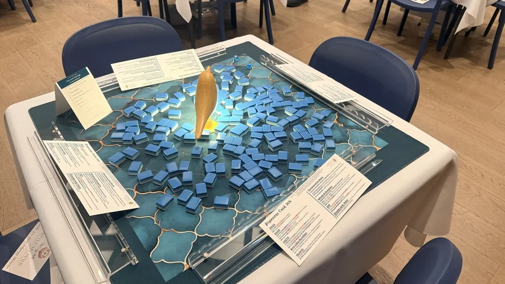 Teal and marble mahjong tiles in play at a curated itsaMahjing event