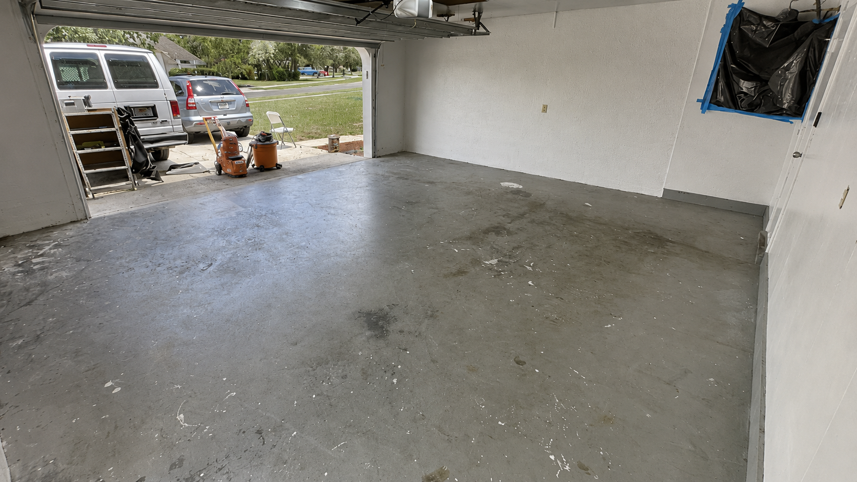 Old stained concrete floor before epoxy coating