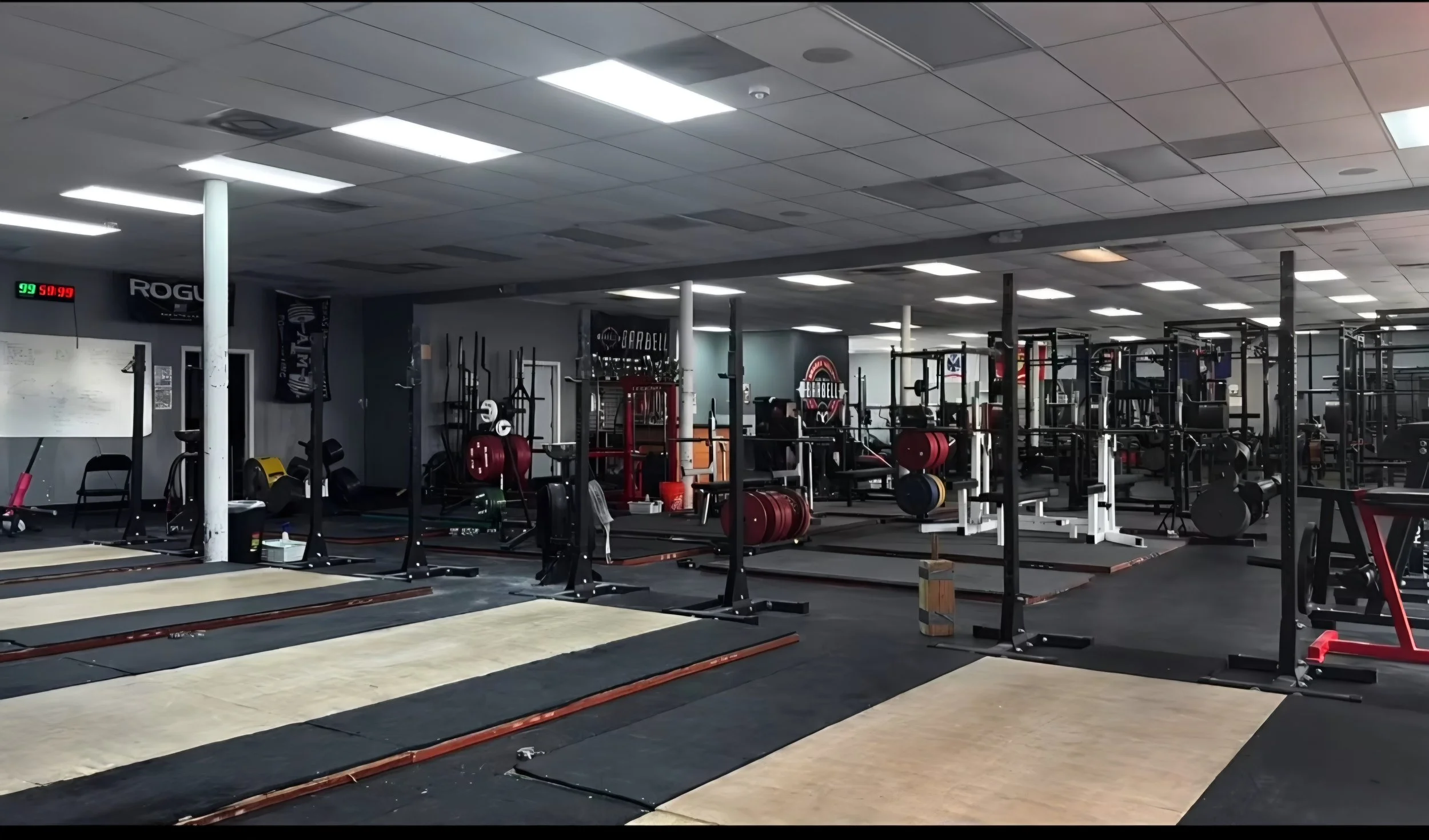 The main training floor and Olympic lifting platforms at Brazos Valley Barbell in College Station, Texas