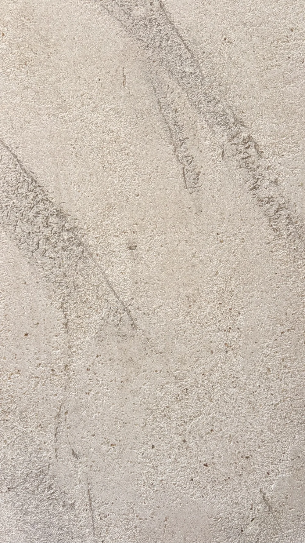 Decorative plaster surface detail showing variations in texture