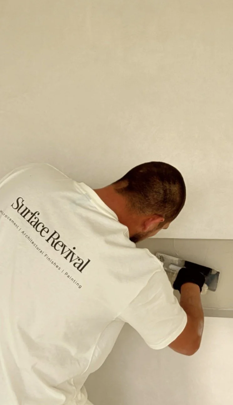 Surface Revival applicator hand-finishing a recessed microcement niche
