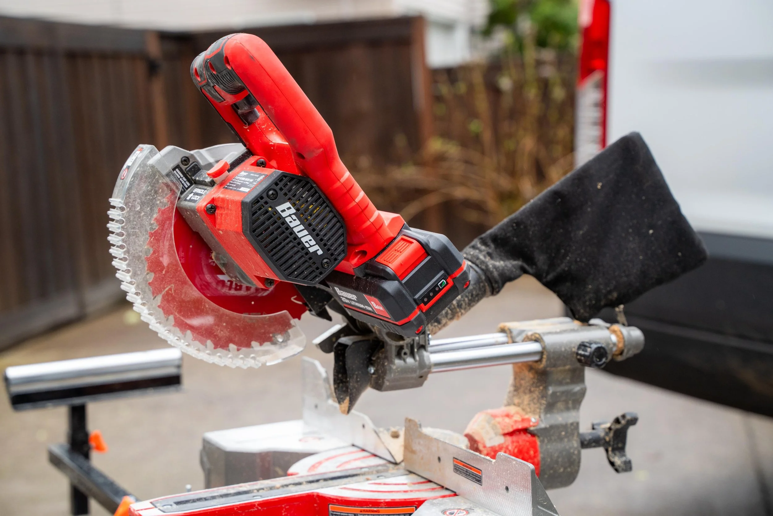 Close-up of a miter saw used to cut window trim on a VResh Construction job site