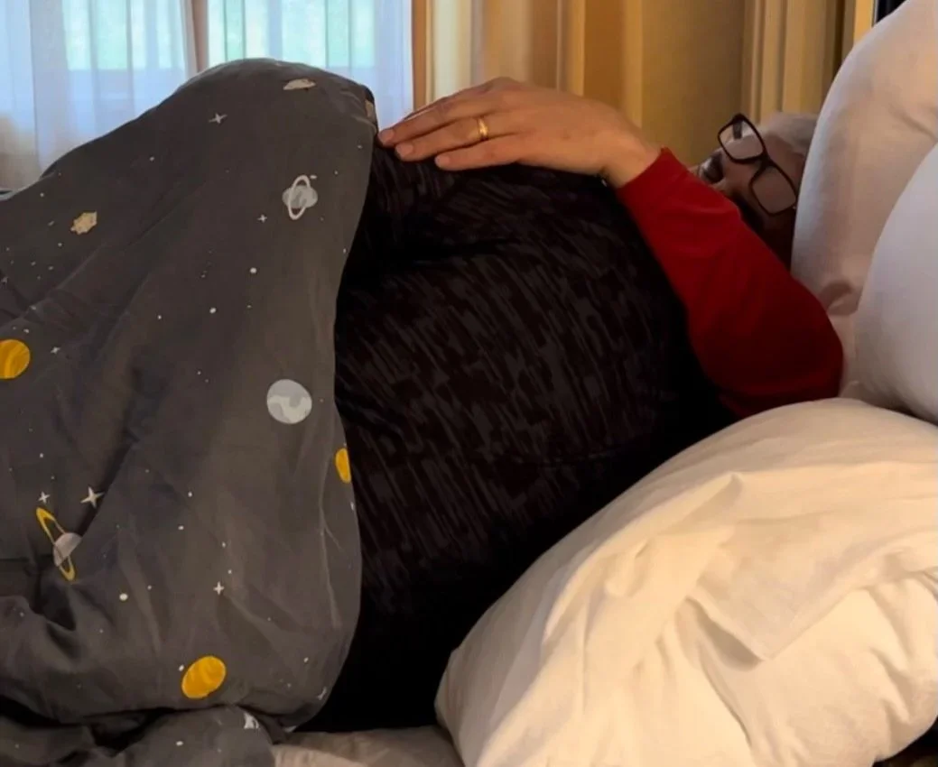  Andrew snuggles with his dad as they watch music videos together. 