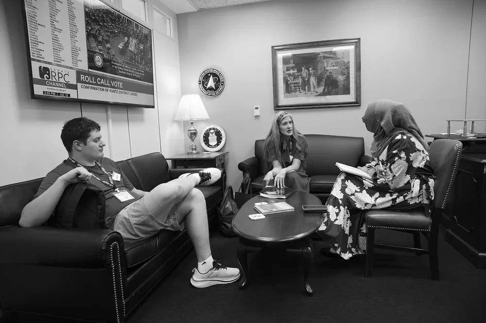 Luke rests on a couch in a Senate lounge.