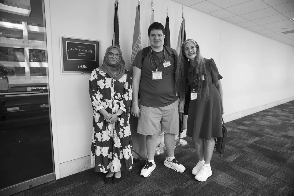 Outside Senator Hickenlooper's office, Luke and Christine pause together.