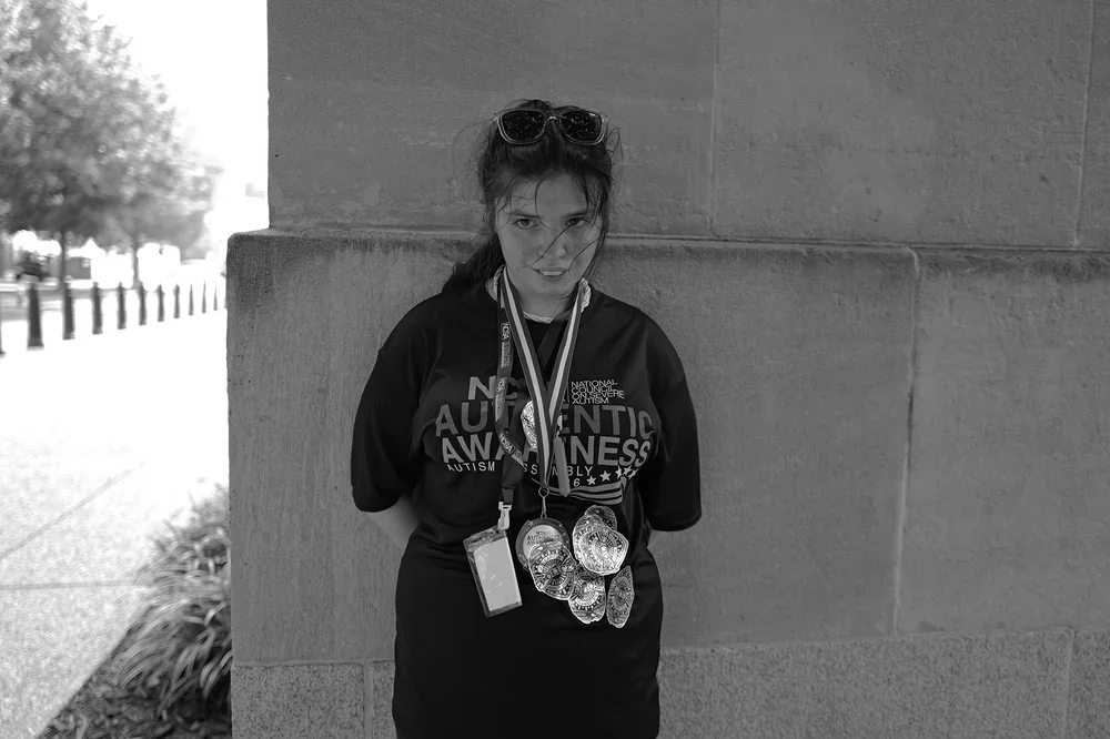 By day's end, Jadyne wears every medal and sticker she was given.