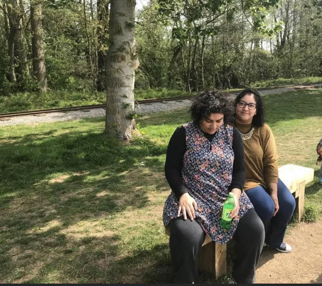  The author with her Actually Autistic daughter, last year at a theme park in the UK. 