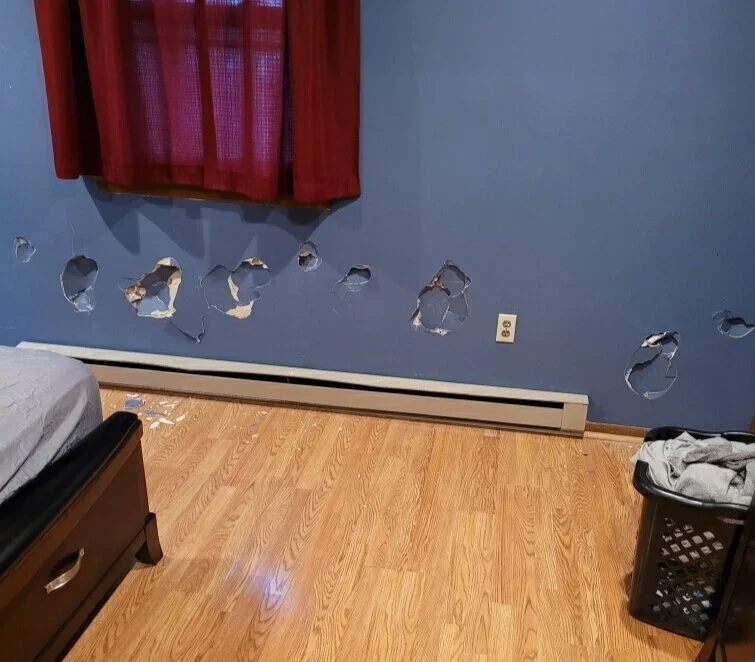  Recent photo of holes in the walls of the twins’ Pennsylvania group home.  