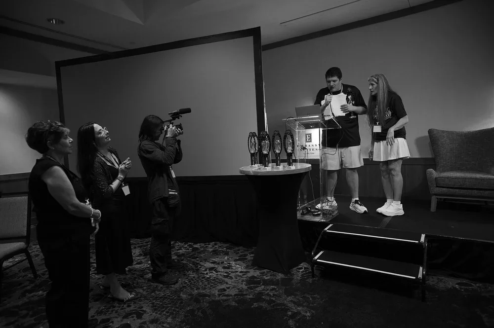 Luke gives his acceptance speech, Christine by his side.