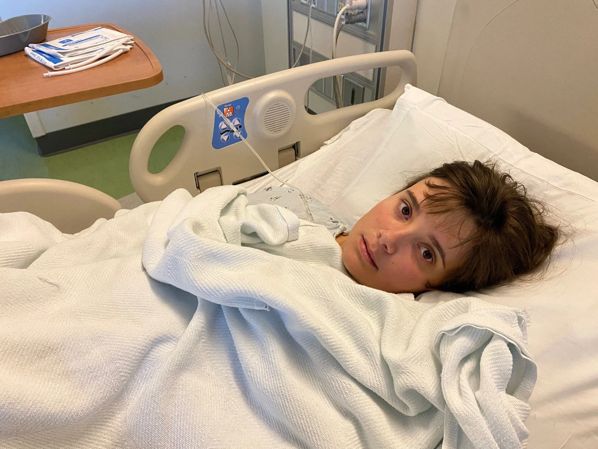 Yesterday at the hospital, about to head down to the OR for removal of the mysterious foreign object from her stomach. She may be nonverbal but her eyes pleaded for help. 