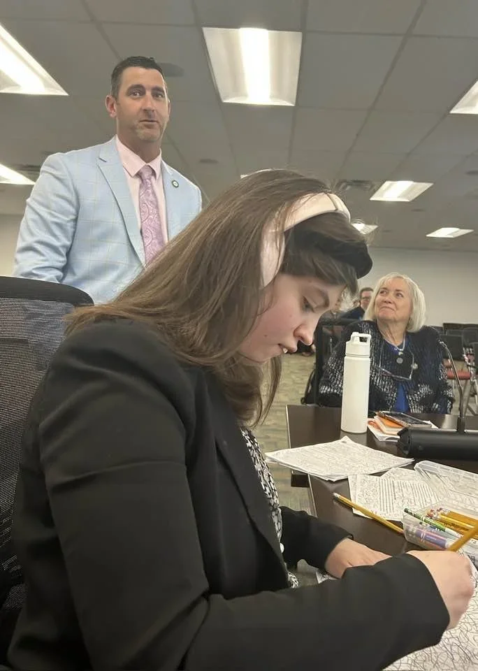 My daughter beside me at our recent Statewide Planning and Policy Council meeting in front of fellow council members TN Representative Clay Doggett (TN-70) and TN Senator Becky Massey (TN-06), two extraordinary champions for disability in the Tennessee General Assembly.