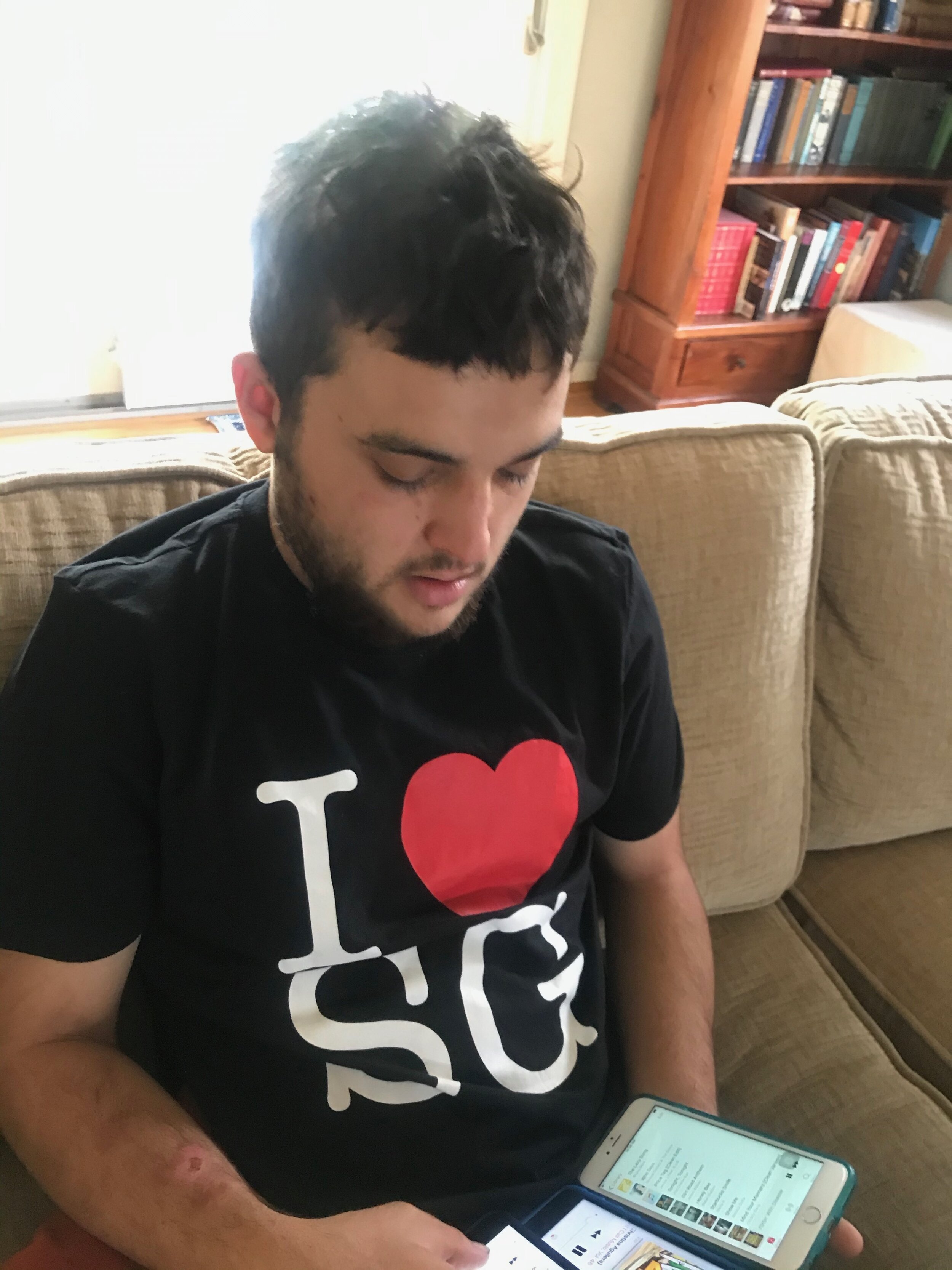  Jonny playing with his iPhones a few months ago. 
