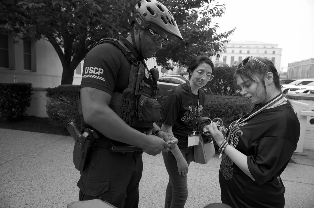 Capitol Police Bike Patrol surprise Jadyne with a special-edition commemorative challenge coin.