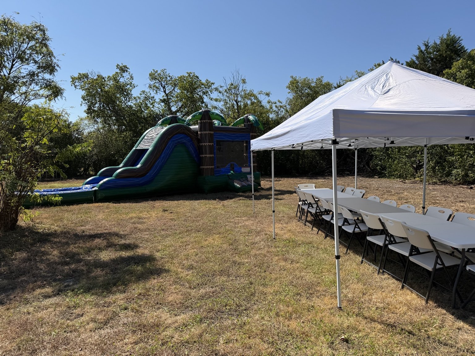 Palm Paradise Combo with a 10×20 tent, tables and chairs at an HCCR outdoor setup.