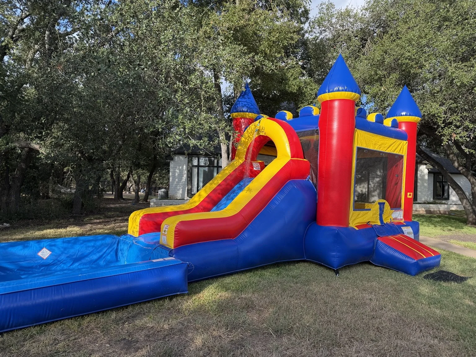 Splash Castle Combo bounce house with slide and pool from Hill Country Celebration Rentals.