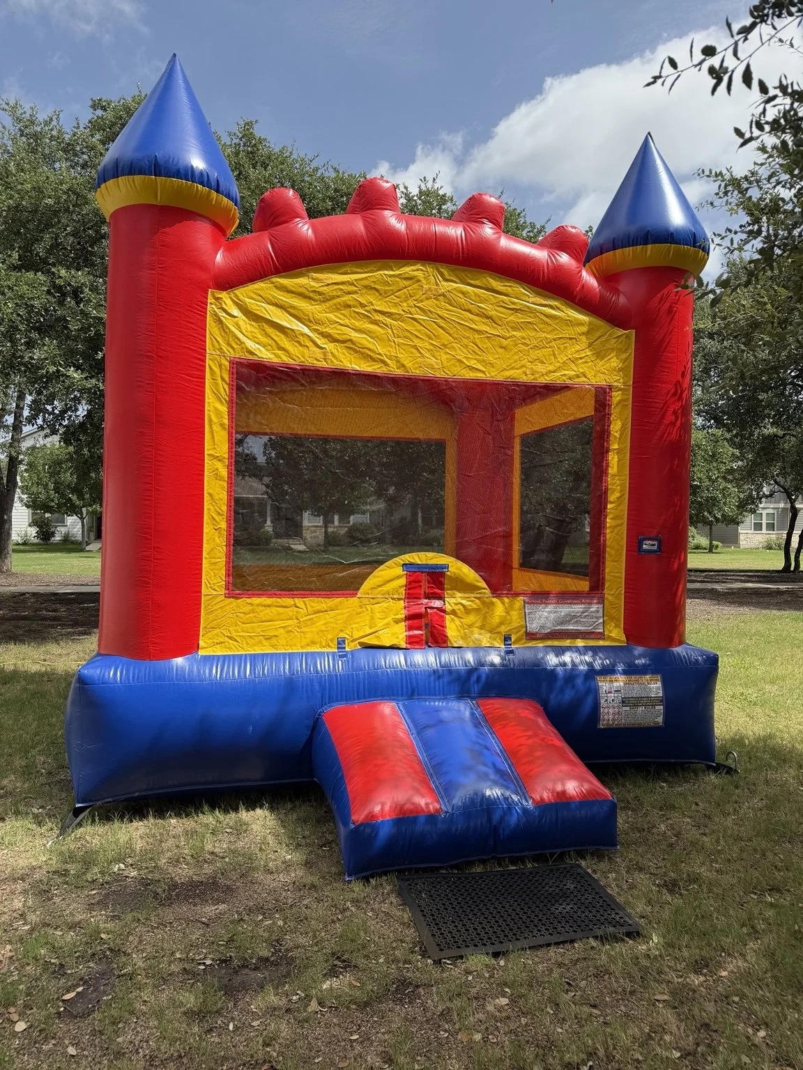 Castle Bounce House set up outdoors by Hill Country Celebration Rentals.