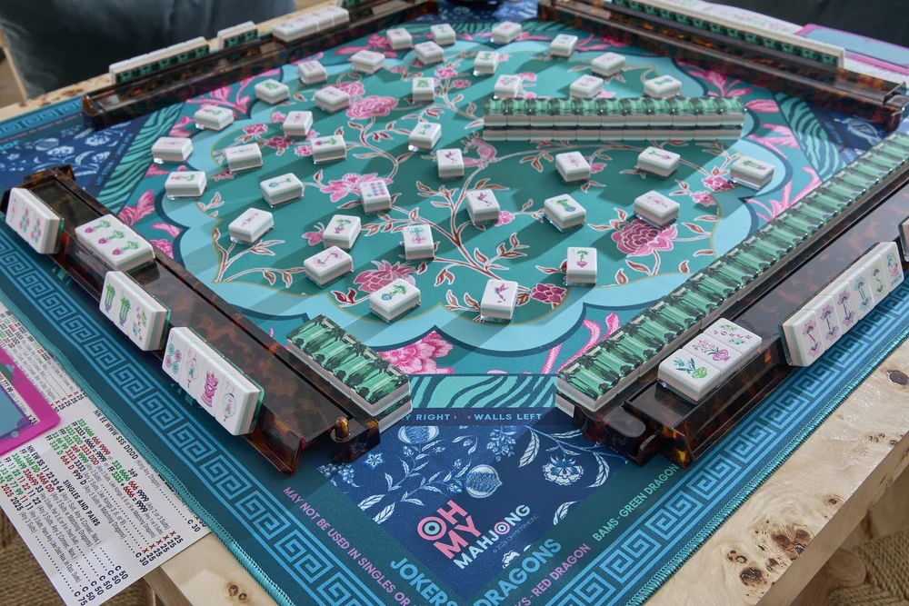 Oh My Mahjong Emerald mahjong tiles at the table: Emerald on the Oh My Mahjong Esme mat · photo: Oh My Mahjong