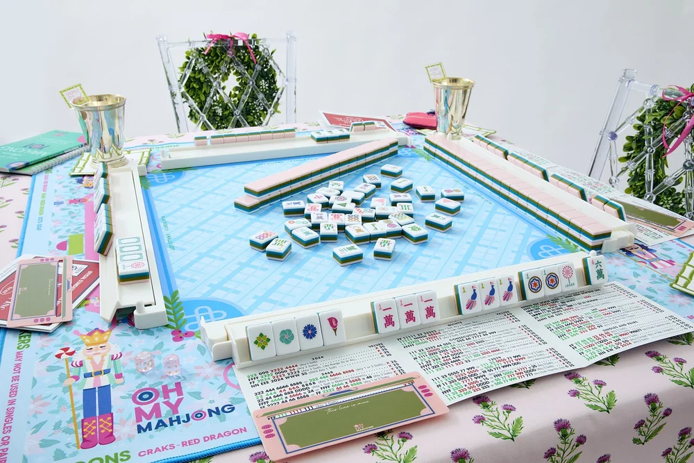 Oh My Mahjong La Fete mahjong tiles at the table: La Fete on the Oh My Mahjong Sugarplum mat · photo: Oh My Mahjong