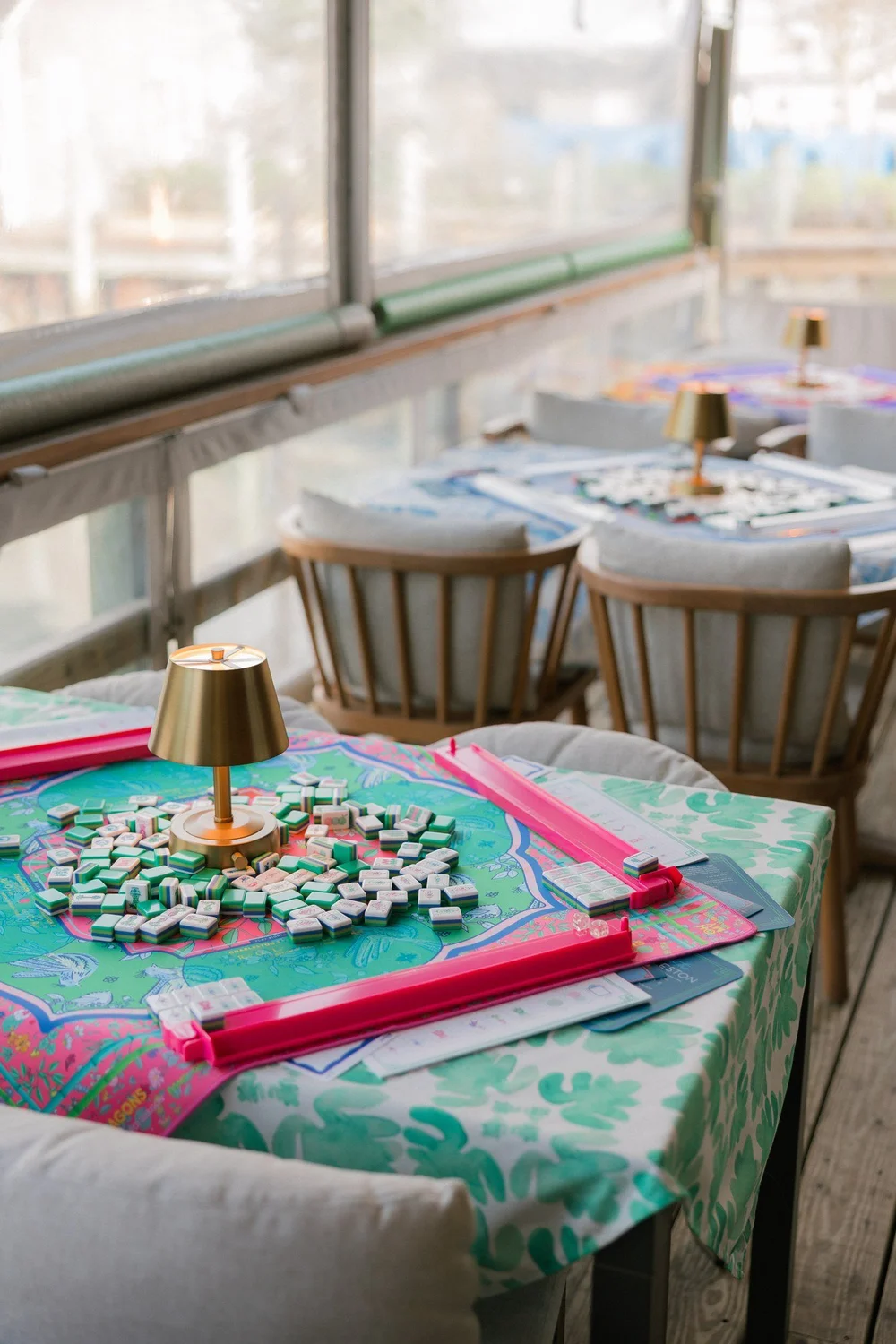Oh My Mahjong Jasmine mahjong tiles at the table: Jasmine on the Oh My Mahjong Enchanted mat · photo: Oh My Mahjong