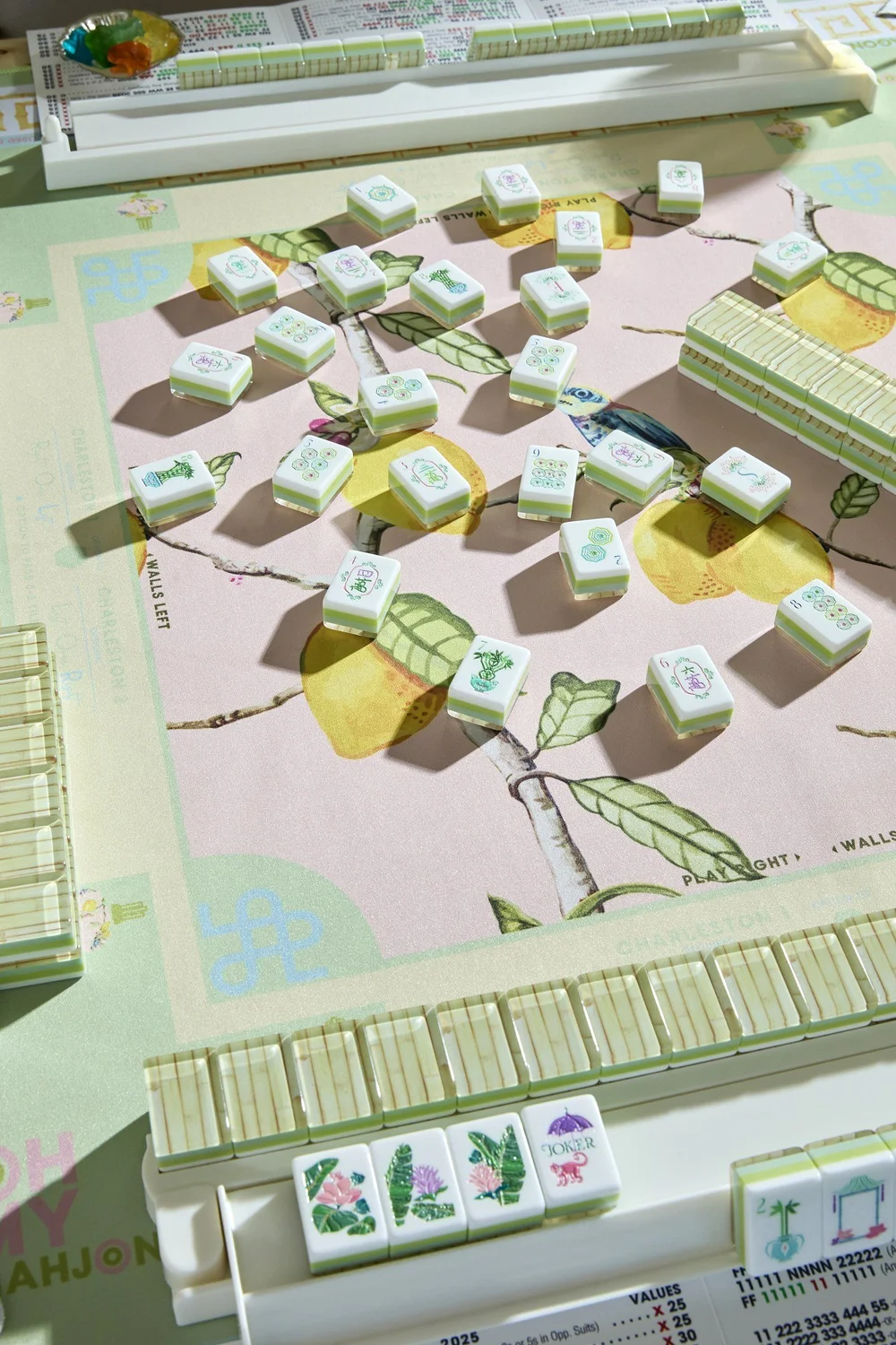 Oh My Mahjong Palm Royale mahjong tiles at the table: Palm Royale on the Oh My Mahjong Citrus Songbird mat · photo: Oh My Mahjong
