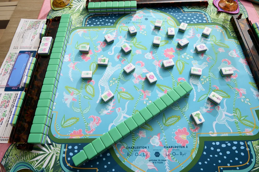 Oh My Mahjong Jasmine mahjong tiles at the table: Jasmine on the Oh My Mahjong Serengeti mat · photo: Oh My Mahjong