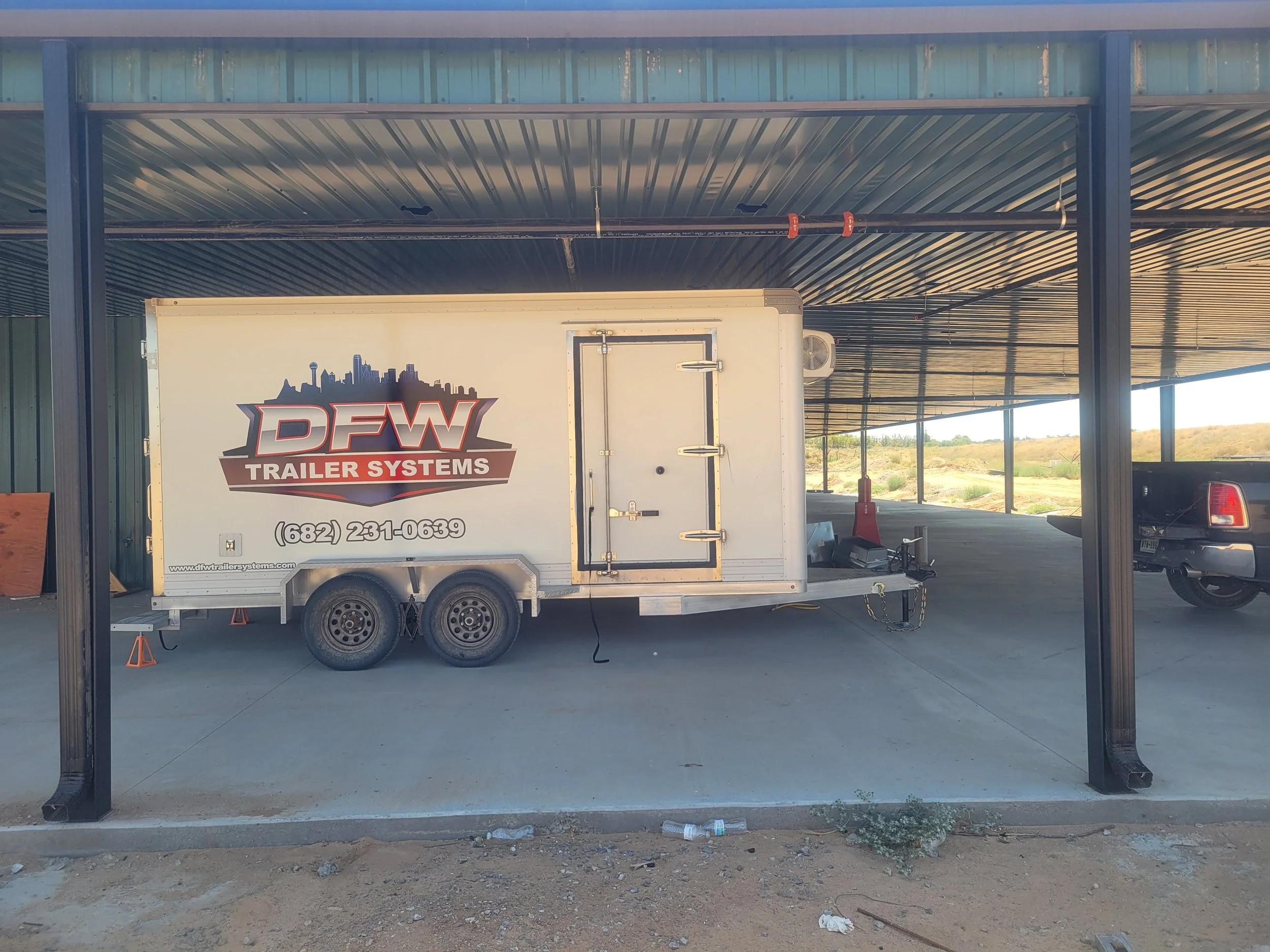 Shelving and E-track inside a 7 by 16 commercial freezer trailer