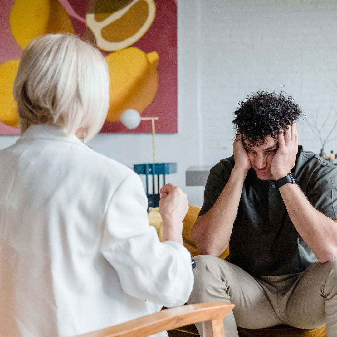 A person discussing difficult feelings with a therapist.