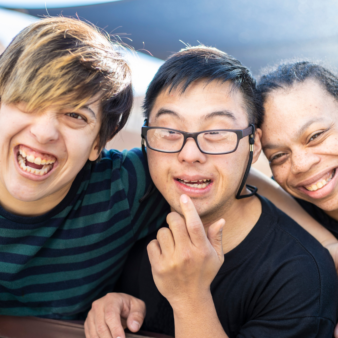 Three friends smiling together