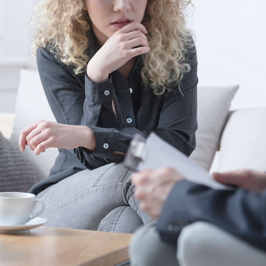 A woman talking through her concerns with a professional.