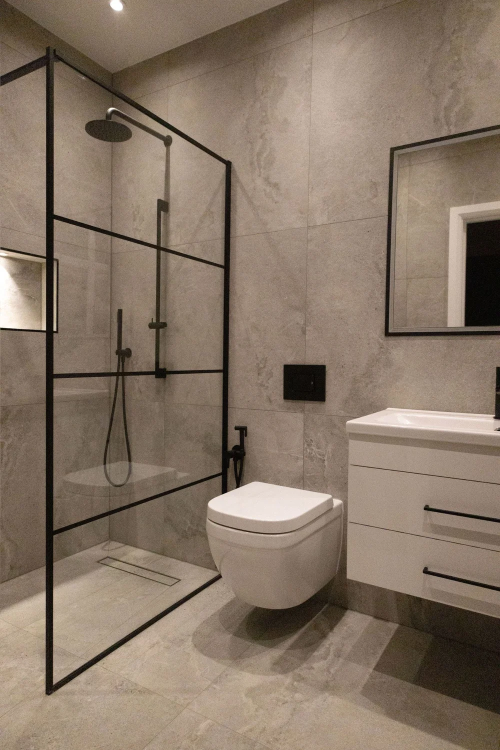 Shower room with walk-in shower and Crittall-style screen in Morden by RELM Interiors