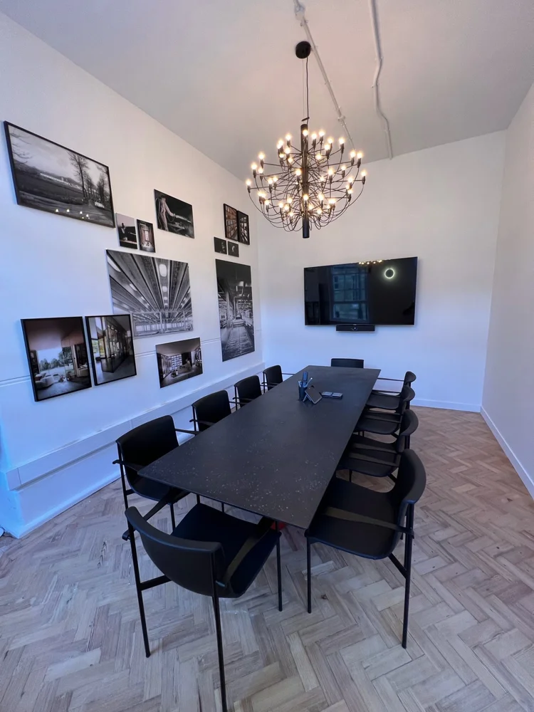 Boardroom with herringbone floor and chandelier in Chelsea